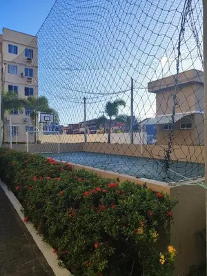 Um jardim no exterior de Apartamento Interno