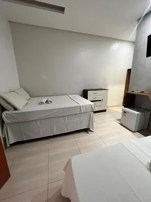 Uma cama ou camas num quarto em Quarto triplo