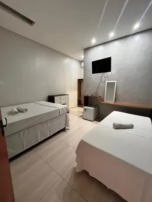 Uma cama ou camas num quarto em Quarto triplo