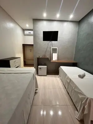 Uma cama ou camas num quarto em Quarto triplo