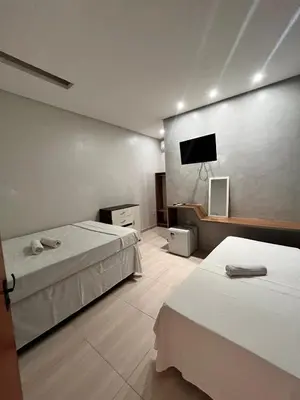 Uma cama ou camas num quarto em Quarto triplo