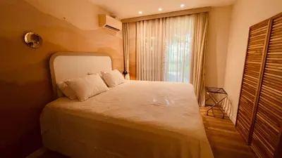 Uma cama ou camas num quarto em Toque de Charme Wai Wai Cumbuco #PÉnaAREIA