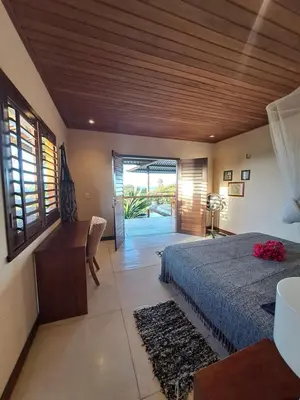 Uma cama ou camas num quarto em Residencia MAPAMÁ Beberibe