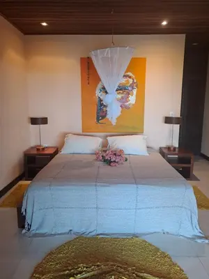 Uma cama ou camas num quarto em Residencia MAPAMÁ Beberibe
