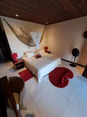 Uma cama ou camas num quarto em Residencia MAPAMÁ Beberibe