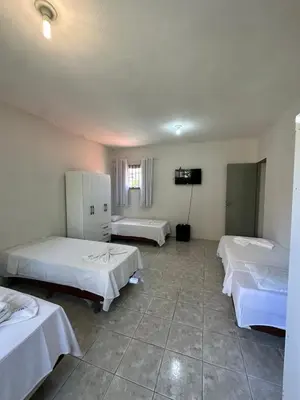 Uma cama ou camas num quarto em Residencial Dumont