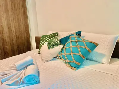 Uma cama ou camas num quarto em Aconchego nordestino em Fortaleza com o melhor de um resort
