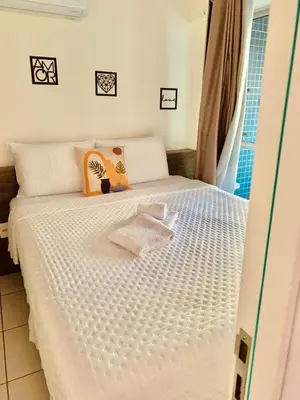 Uma cama ou camas num quarto em Aconchego nordestino em Fortaleza com o melhor de um resort