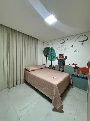 Uma cama ou camas num quarto em Casa Moderna & Conforto