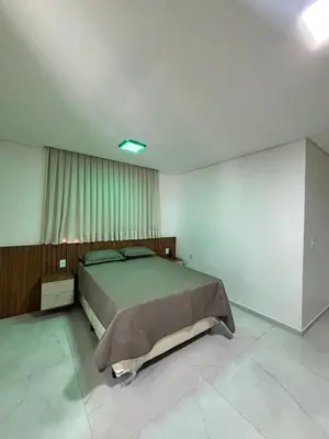 Uma cama ou camas num quarto em Casa Moderna & Conforto