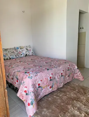 Uma cama ou camas num quarto em Casa Amarela Caponga