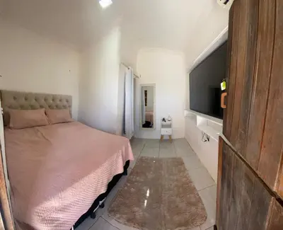 Uma cama ou camas num quarto em Casa Amarela Caponga