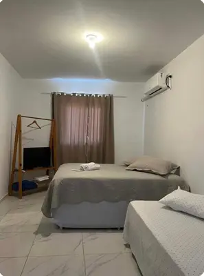 Uma cama ou camas num quarto em Apartamento da Kenia