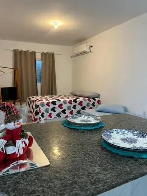 Uma área de estar em Apartamento da Kenia