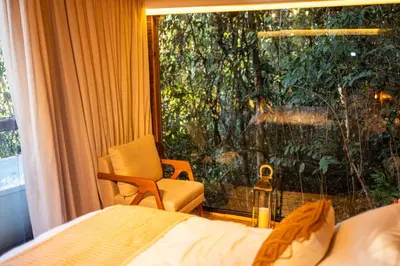 Uma cama ou camas num quarto em Cabana da arvore Guaramiranga