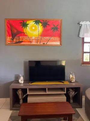 Uma televisão e/ou sistema de entretenimento em Casa em Moitas