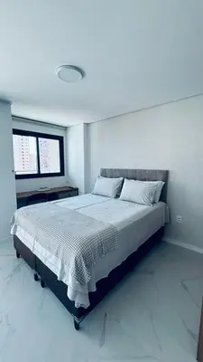 Uma cama ou camas num quarto em Apartamento completo a 500m da Beira