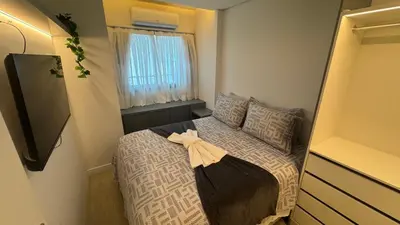 Uma cama ou camas num quarto em Beach Class Meireles