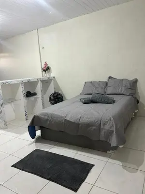 Uma cama ou camas num quarto em Studio in Maraponga Comfortable Wi-Fi and Security