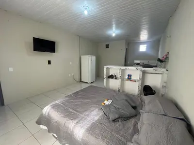 Uma cama ou camas num quarto em Studio in Maraponga Comfortable Wi-Fi and Security