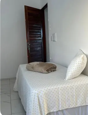 Uma cama ou camas num quarto em Apartamento da Kenia