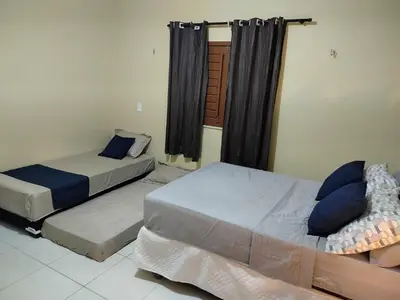 Uma cama ou camas num quarto em Casa Fortim - Fortim Haus