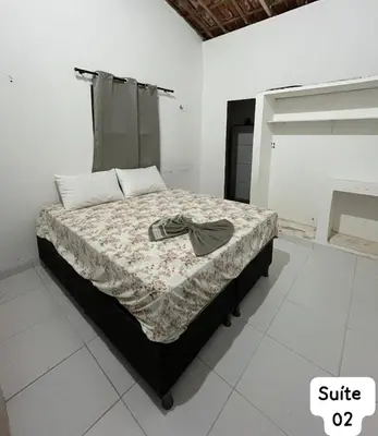 Uma cama ou camas num quarto em Casa Fundo de Quintal