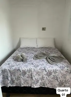 Uma cama ou camas num quarto em Casa Fundo de Quintal