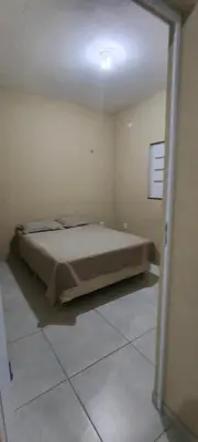 Uma cama ou camas num quarto em Casa do paraíso