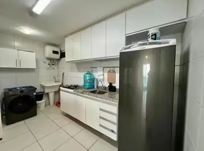 A cozinha ou kitchenette de Terraço Atlântico Vista Mar 2 quartos 2 banheiros