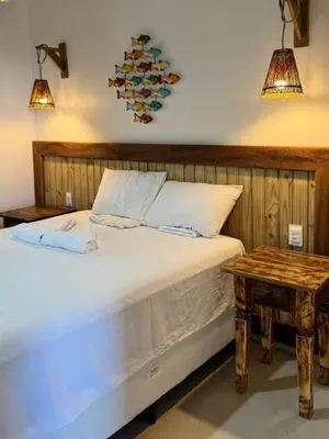 Uma cama ou camas num quarto em Pousada Caponga Praia Mar