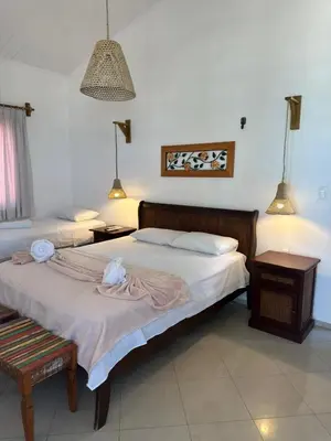 Uma cama ou camas num quarto em Pousada Caponga Praia Mar