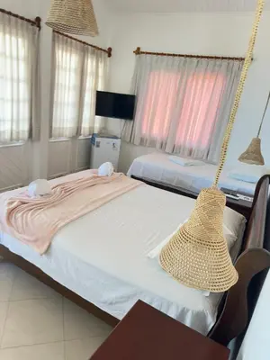 Uma cama ou camas num quarto em Pousada Caponga Praia Mar