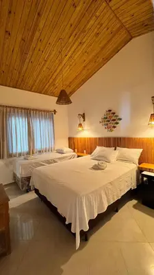 Uma cama ou camas num quarto em Pousada Caponga Praia Mar