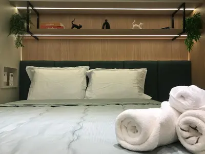 Uma cama ou camas num quarto em Studio Rubi no Meireles próximo à Beira-Mar