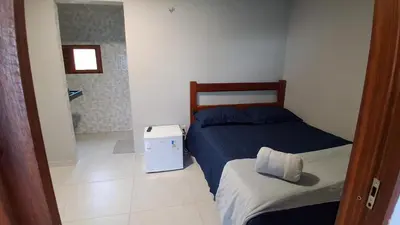 Uma cama ou camas num quarto em Chalé Lá Aurora