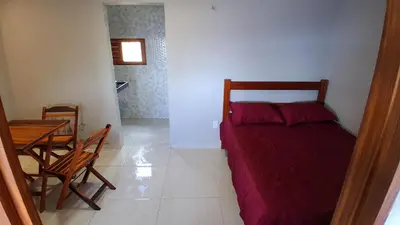 Uma cama ou camas num quarto em Chalé Lá Aurora