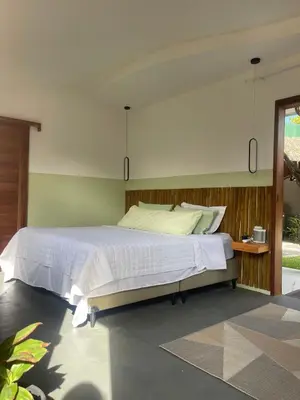 Uma cama ou camas num quarto em Casa Uai - Coziness on the coast of Ceará
