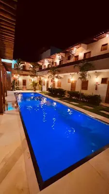 A piscina em ou perto de Suítes duplas e triplas com piscina em Fortim