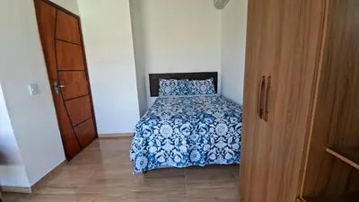 Uma cama ou camas num quarto em Haus Regenbogen