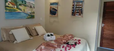 Uma cama ou camas num quarto em Vila Pescador Fortim