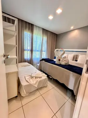 Uma cama ou camas num quarto em Térreo Completo Varanda VG SUN CUMBUCO