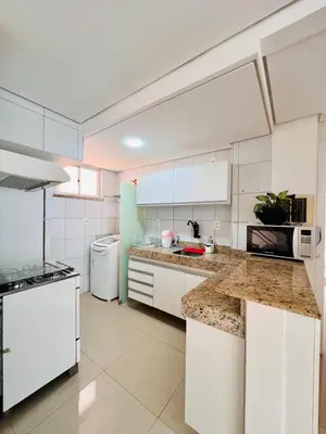 A cozinha ou kitchenette de Super Apartamento Palm Beach