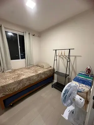 Uma cama ou camas num quarto em Apartamento novo, com vista para o mar e pé na areia!