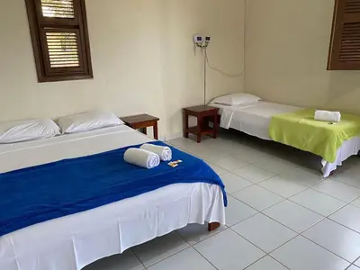 Uma cama ou camas num quarto em Mihika Emboaca Beach House