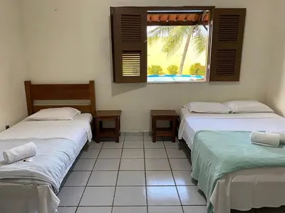 Uma cama ou camas num quarto em Mihika Emboaca Beach House