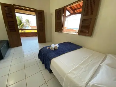Uma cama ou camas num quarto em Mihika Emboaca Beach House