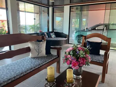 Uma área de estar em Casa de praia Porto das dunas