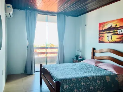 Uma cama ou camas num quarto em Casa de praia Porto das dunas