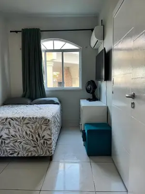 Uma cama ou camas num quarto em Green Paradise Residence Praia de Canoa Quebrada